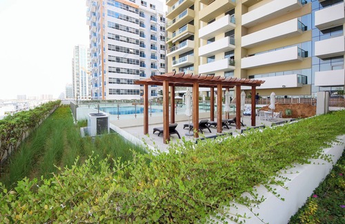 Discovery Gardens Apartamento | Silk Valley - Brand new 1B with pool view