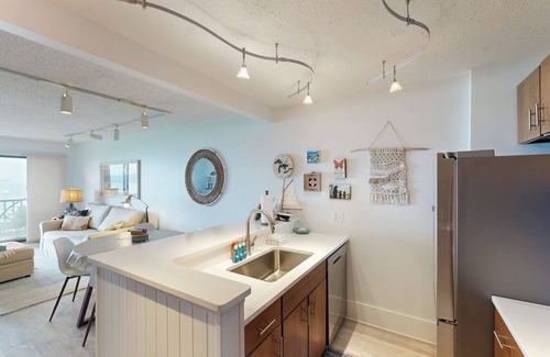 Maple City Condominio | Single-level lakefront hideaway with a deck, fireplace, & washer/dryer