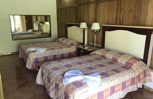 La Fortuna Hotel | Sleep VIP con habitación privada con vistas al Volcán Arenal