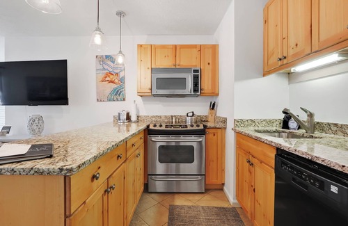 Charlevoix Condominio | Suite de lujo con un toque de hogar en el centro de Charlevoix.