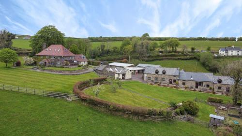 Hawkridge Casa | Smiddy Cottage, Historic Village Hub with Spacious Lounge, High Ceilings, and Wood Stove