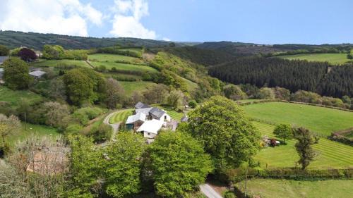 Hawkridge Casa | Smiddy Cottage, Historic Village Hub with Spacious Lounge, High Ceilings, and Wood Stove