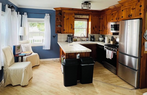 Snug Harbor Cabaña | Soak in enchanting water views. Fully-fenced yard for family and pets!