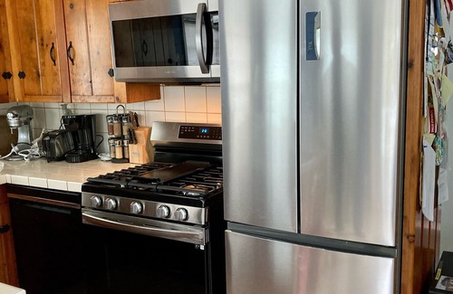 Snug Harbor Cabaña | Soak in enchanting water views. Fully-fenced yard for family and pets!