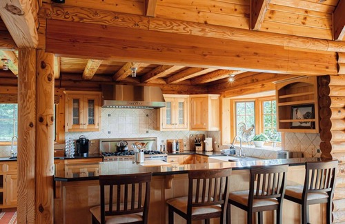 Meadows Of Dan Cabina | Soak in the hot tub @ Stonewood Manor - Where Luxury and Cozy Meet.