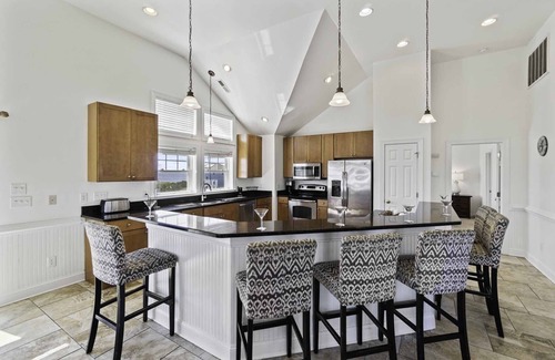 Wind Over Waves Casa | Soundside Dog Friendly w/ Pool, Elevator, Hot Tub, Game and Theater Rooms