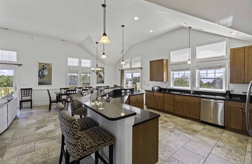 Wind Over Waves Casa | Soundside Dog Friendly w/ Pool, Elevator, Hot Tub, Game and Theater Rooms