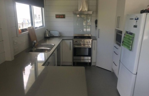 Pauanui Casa | La casa de playa clásica - con un toque moderno.