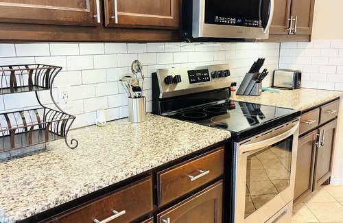 Ennis Casa | Spacious 5 Bedroom Home, Huge Swim Spa & Private Theater with Popcorn Machine!