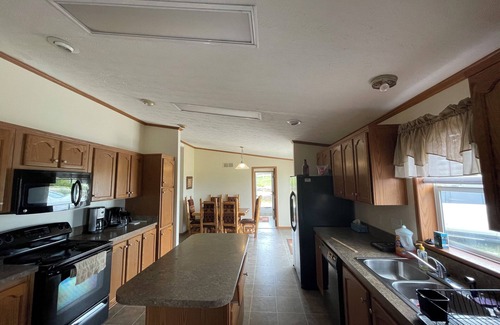Drexel Casa | Spacious 5-bedroom house overlooking a serene 20 acre lake