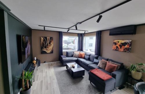 Stavanger Apartamento | Spacious and central apartment with a private garden, Free parking and Free EV recharging