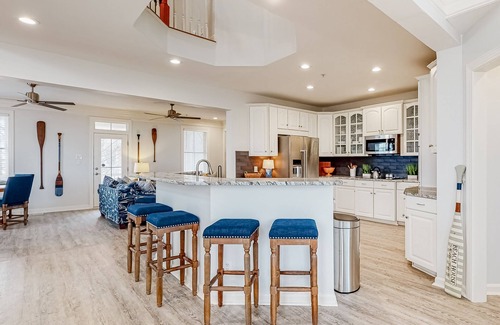 Sunset Island Casa | Spacious beachside home with fireplace, washer/dryer, pools, dock, & gym