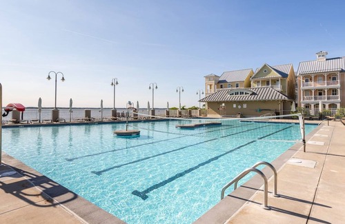 Sunset Island Casa | Spacious beachside home with fireplace, washer/dryer, pools, dock, & gym