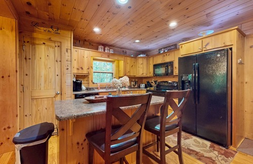 Cullowhee Casa | Spacious cabin near lake & boat ramp with firepit, foosball, bar, decks & WiFi