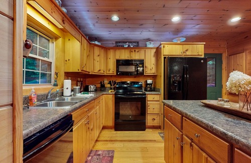 Cullowhee Casa | Spacious cabin near lake & boat ramp with firepit, foosball, bar, decks & WiFi