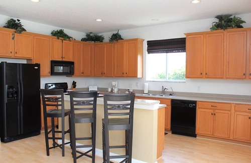 Kissimmee Casa | Amplia casa completamente amueblada con piscina climatizada y spa, a 25 minutos de Disney y Universal