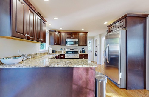 Mashpee Casa | Spacious home close to Peters Pond Beach with porch, AC, W/D, & water view