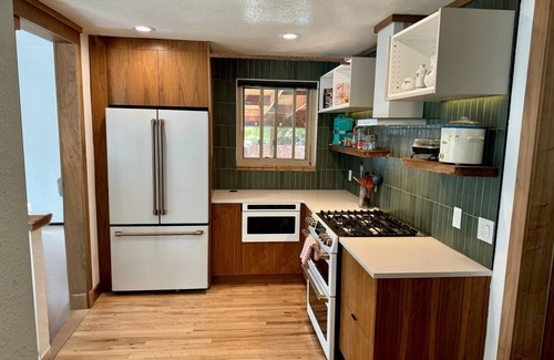 West Highland Casa | Spacious midmod home 10 min to downtown, Peloton, fire pit, fenced yard