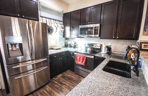 Longmont Casa | SpeakEasy Suite, relax in classic luxury with private living space and bedroom