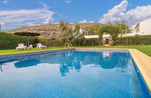 Teba Casa | Spend a relaxing vacation in this idyllically located vacation home with pool access.
