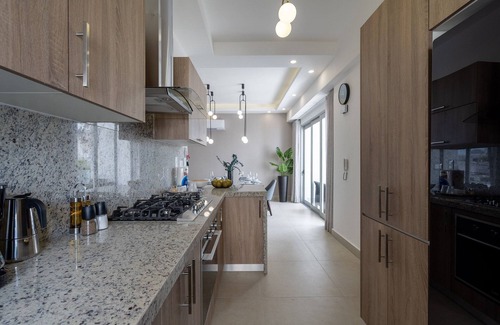 Ensanche Quisqueya Condominio | Splendid-KingBed-3BR-Pool-AC-Modern-WiFi-Yellowkey