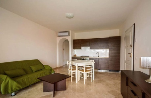 Porto Pozzo Apartamento | Espléndido apartamento con vistas al mar (N ° 12)