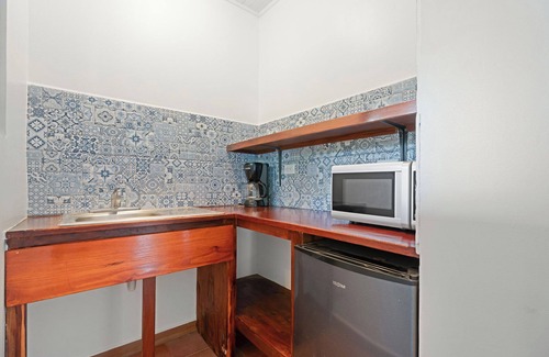 Playa Avellanas Villa | Standard Suite: Cozy One-Bedroom Suite with Full Bed, Kitchenette & Pool Access