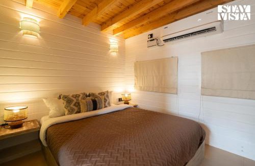 Morjim Villa | StayVista at Woodhouse Story with Pool, WiFi, AC