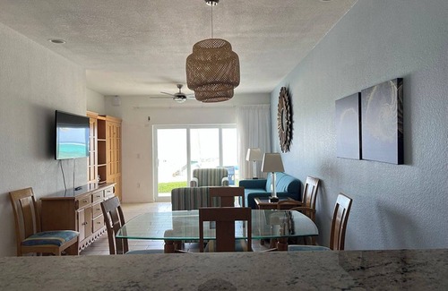Colliers Bay Complejo | Step onto beach! Beach front 2 bed + bath condo with full kitchen, LR/DR, patio