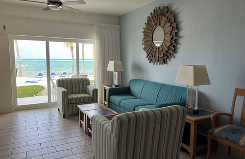 Colliers Bay Complejo | Step onto beach! Beach front 2 bed + bath condo with full kitchen, LR/DR, patio