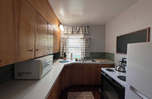 Sheridan Casa | "Steps from downtown and the park, this cozy mid-century hideaway offers comfort, charm, and a private outdoor escape."