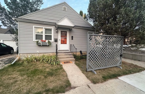 Sheridan Casa | "Steps from downtown and the park, this cozy mid-century hideaway offers comfort, charm, and a private outdoor escape."