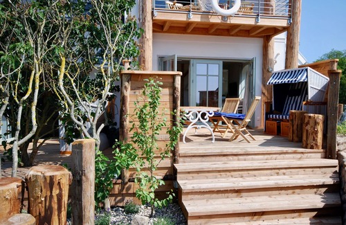 Fehmarnsund Condominio | Strandhaus-fehmarn, Captains-deck, Strandlage und Meerblick, Terrasse und Garten