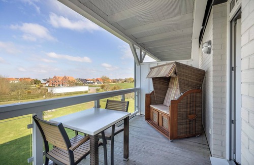 Wremen Apartamento | Strandnahe, Hundefreundliche Ferienwohnung mit Sauna und Balkon mit Strandkorb