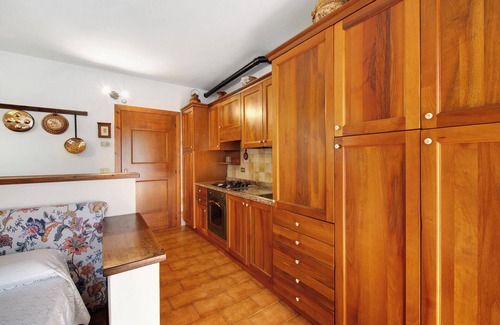 Domegge di Cadore Apartamento | Estudio 'Monolocale Monti Pallidi' con vistas a la montaña, terraza privada y jardín compartido