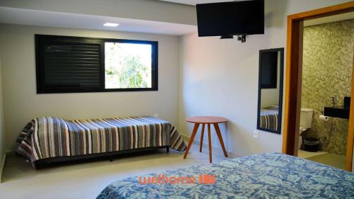 Delfinopolis Apartamento | Studio em Delfinopolis com praia privativa