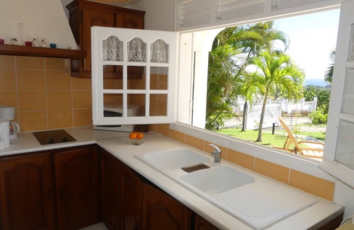 Capesterre-Belle-Eau Apartamento | Estudio sureste, gran terraza frente al mar en jardín tropical.