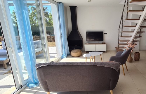 Sant Jaume Mediterrani Casa | Stunning modern villa with stunning Son Bou beach views, heated pool
