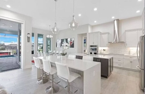 Eight Lakes Casa | Stunning New Waterfront Luxury Villa with oversized Heated pool and Hot tub!