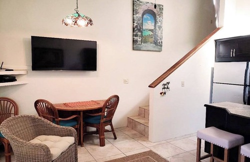 Estate Enighed Condominio | Stunning Sunsets, Modern A/C, & Updated Living – Your Dream Condo Awaits!