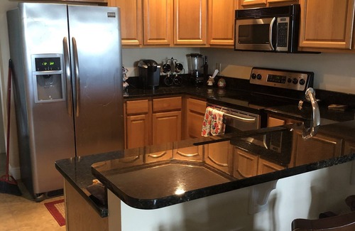 Steinhatchee Condominio | Stunning Top Floor Views of The Steinhatchee River with Private Boat Slip /Pool!