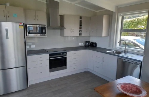 Korokoro Casa | Stunning view & hot tub. New house handy to town