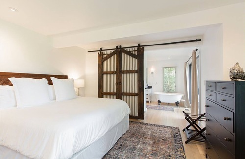 Hendersonville Cabaña | Stylish cottage bordering one of the farm's sweeping pastures.