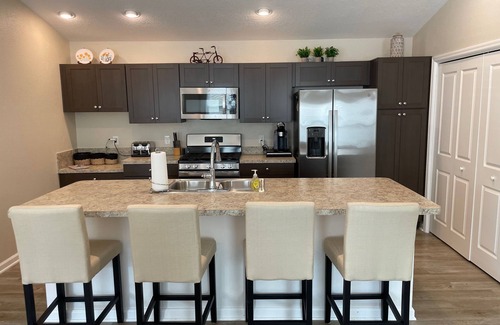 Okahumpka Casa | Stylish home with gourmet kitchen, dual garages, and private golf cart!