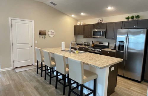 Okahumpka Casa | Stylish home with gourmet kitchen, dual garages, and private golf cart!