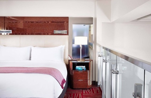 Downtown Dallas Hotel | Stylish Multi-Level Suite with Bold Interiors and Loft Architecture