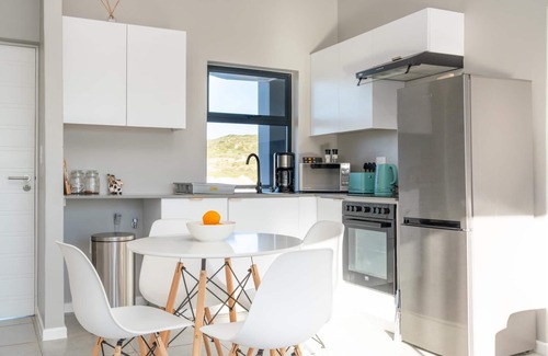 Mykonos Apartamento | Stylish Urban Stay | Balcony | Lagoon View