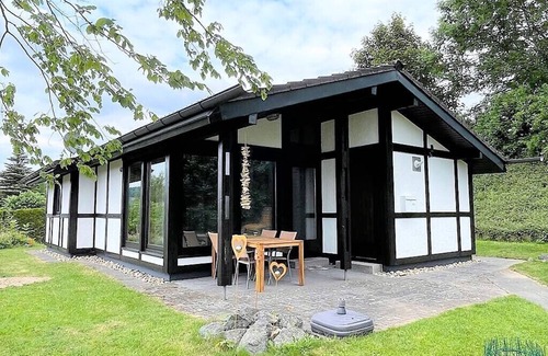 Feriendorf Hennesee Casa | Stylish vacation home with covered terrace.