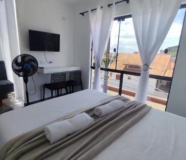 Praia de Leste Casa | Suíte 25 família Praia de Leste