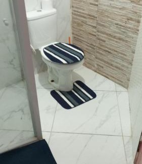 Praia Grande Apartamento | Suíte frente mar
